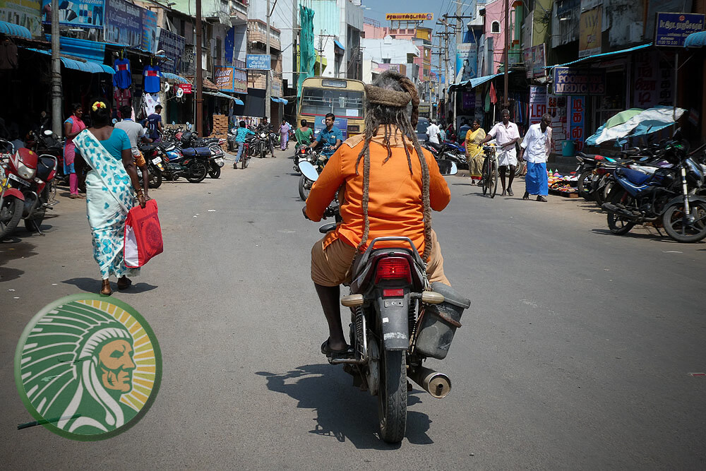 Spiritual itinerants, a Sadhus on a scooter